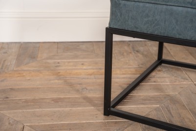 worn denim footstool with metal legs